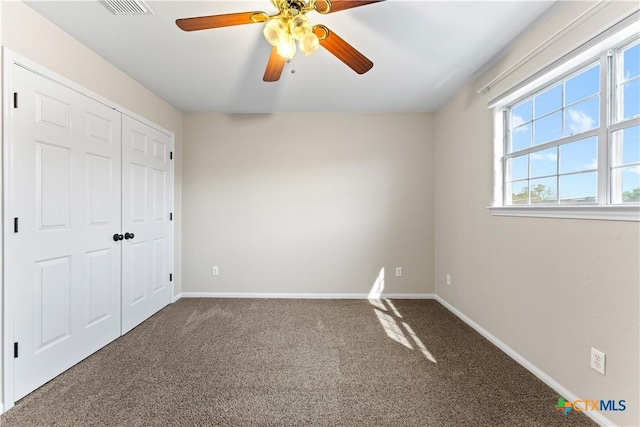16047 Charlya Dr, Temple, TX 76502 - unfurnished bedroom with carpet, baseboards, a closet, and ceiling fan