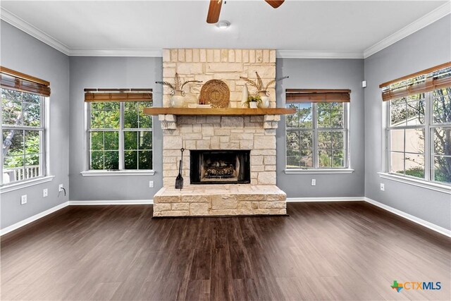 16047 Charlya Dr, Temple, TX 76502 - unfurnished living room featuring a ceiling fan, dark wood finished floors, plenty of natural light, and crown molding