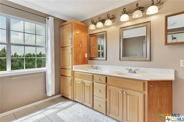 16047 Charlya Dr, Temple, TX 76502 - bathroom featuring tile patterned floors, double vanity, baseboards, and crown molding