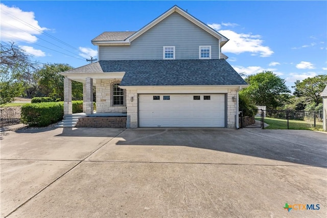 16047 Charlya Dr, Temple, TX 76502 - view of front facade with stone siding, concrete driveway, fence, and a shingled roof