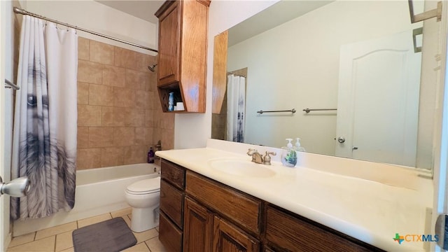 full bathroom featuring tile patterned floors, vanity, shower / bath combination with curtain, and toilet