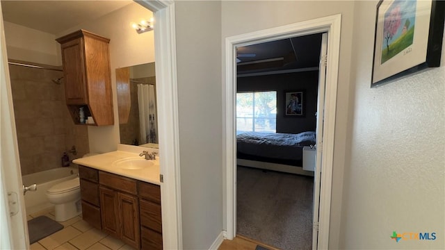 full bathroom featuring tile patterned floors, vanity, toilet, and shower / bath combo