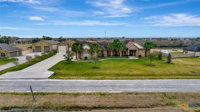 ranch-style house featuring a garage and a front lawn