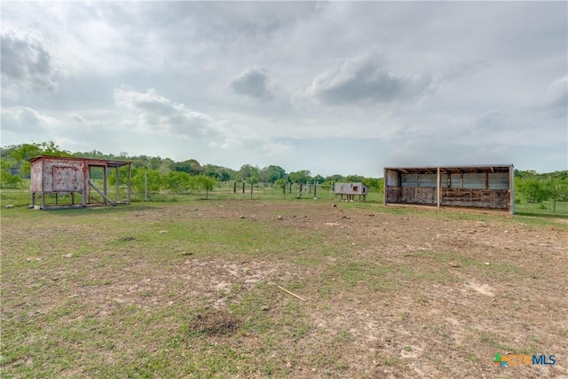 256 County Road 481, Gonzales, TX 78629 - view of yard featuring exterior structure, a rural view, and an outbuilding