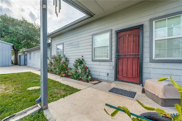 256 County Road 481, Gonzales, TX 78629 - doorway to property with a lawn