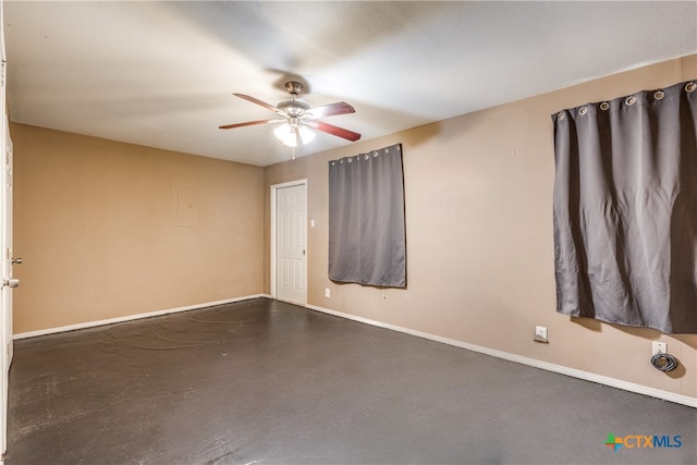 256 County Road 481, Gonzales, TX 78629 - unfurnished room with finished concrete floors, baseboards, and a ceiling fan