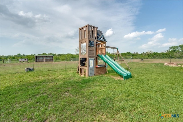 256 County Road 481, Gonzales, TX 78629 - view of play area featuring a lawn