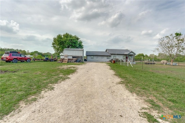 256 County Road 481, Gonzales, TX 78629 - view of front of home with driveway and a front yard