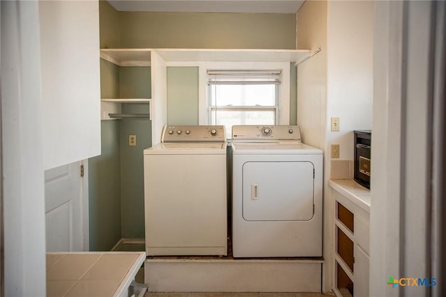 clothes washing area featuring washing machine and dryer