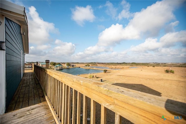 wooden deck featuring a water view