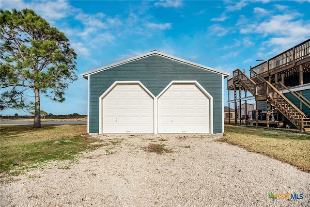 garage with a lawn