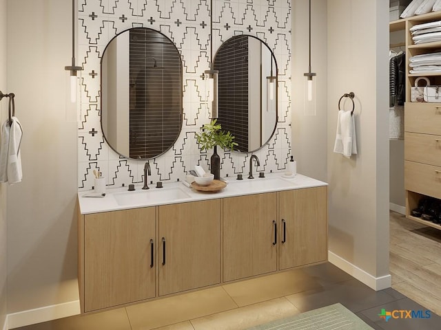 bathroom with vanity, backsplash, and tile patterned flooring