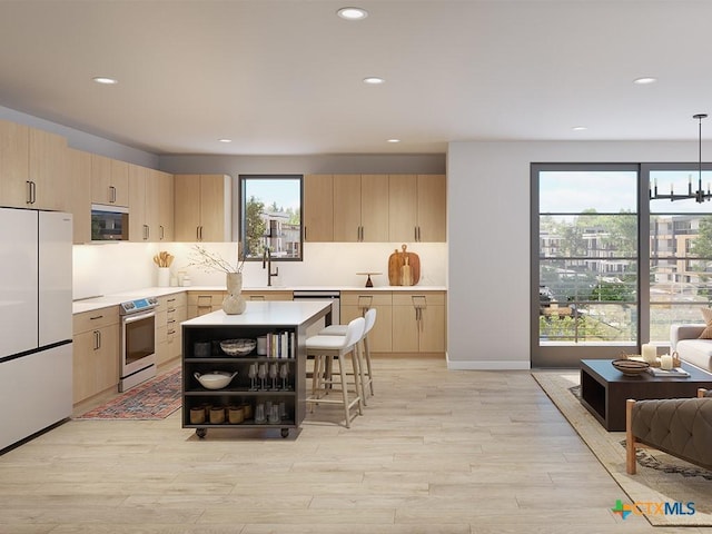 kitchen featuring light brown cabinetry, built in microwave, decorative light fixtures, white fridge, and stainless steel electric range oven