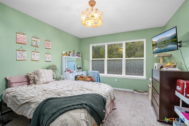 bedroom with carpet flooring and baseboards