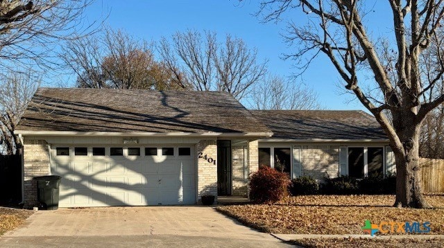 single story home featuring a garage