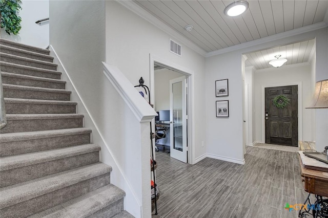 2844 Klein Way, New Braunfels, TX 78130 - staircase featuring crown molding, wood finished floors, wood ceiling, and baseboards
