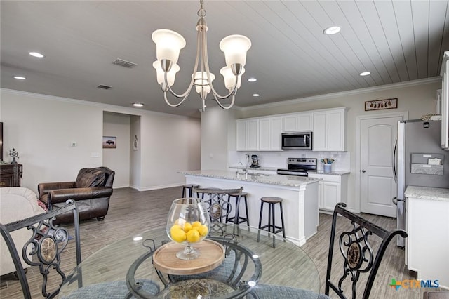 2844 Klein Way, New Braunfels, TX 78130 - dining room featuring recessed lighting, a chandelier, light wood-style flooring, crown molding, and baseboards
