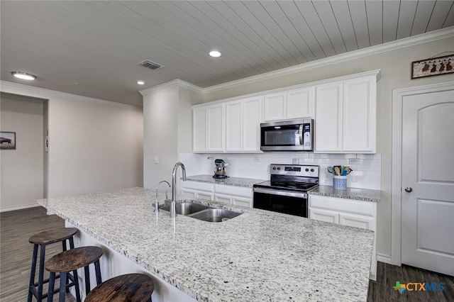 2844 Klein Way, New Braunfels, TX 78130 - kitchen with stainless steel appliances, a sink, an island with sink, dark wood-style flooring, and white cabinets