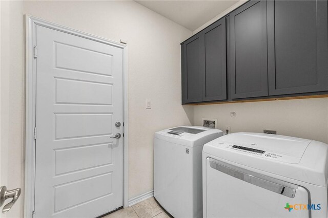 14902 Ardilla, San Antonio, TX 78217 - clothes washing area with cabinet space, independent washer and dryer, light tile patterned floors, and baseboards