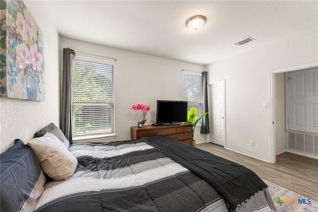 14902 Ardilla, San Antonio, TX 78217 - bedroom featuring light wood-style floors and baseboards