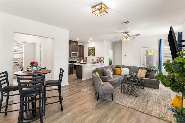 14902 Ardilla, San Antonio, TX 78217 - living room with light wood finished floors, recessed lighting, ceiling fan, and baseboards