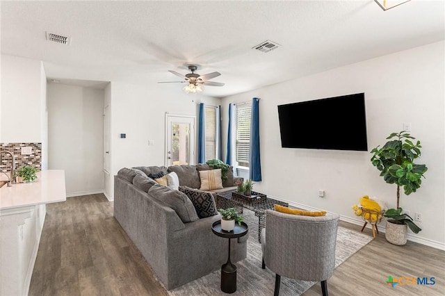 14902 Ardilla, San Antonio, TX 78217 - living area featuring wood finished floors, ceiling fan, and baseboards