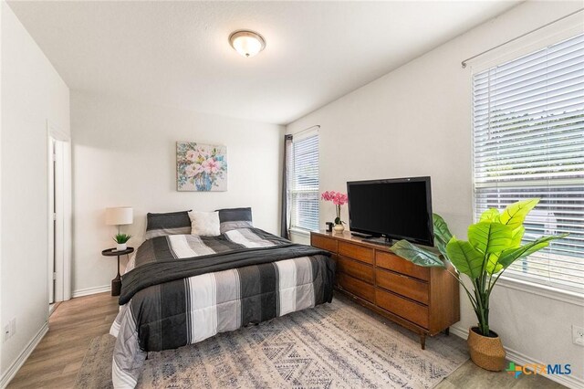 14902 Ardilla, San Antonio, TX 78217 - bedroom featuring light wood-style floors and baseboards