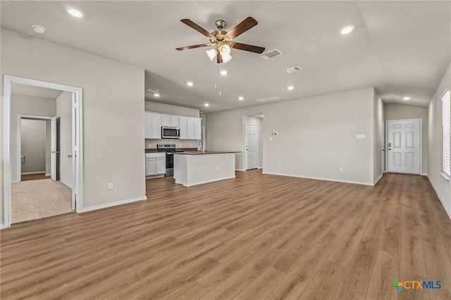 702 Stonevalley Rd, Temple, TX 76502 - unfurnished living room featuring ceiling fan, light wood-style floors, and recessed lighting