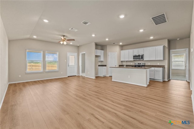 702 Stonevalley Rd, Temple, TX 76502 - unfurnished living room featuring recessed lighting, light wood-style flooring, a ceiling fan, and lofted ceiling