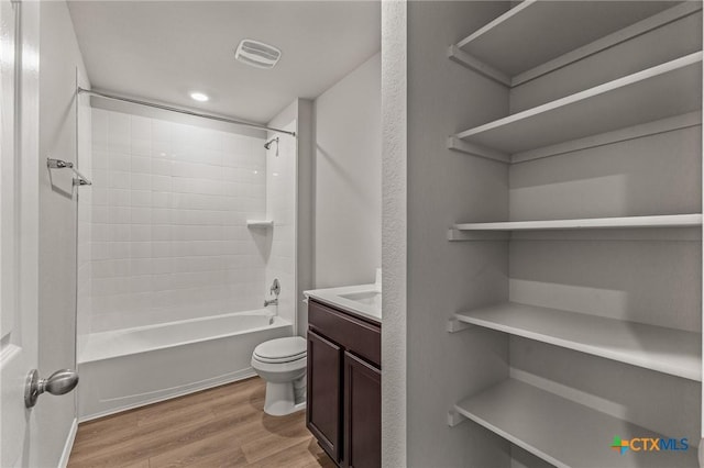 702 Stonevalley Rd, Temple, TX 76502 - bathroom featuring wood finished floors, vanity, and shower / tub combination