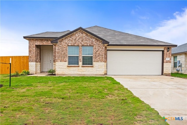 702 Stonevalley Rd, Temple, TX 76502 - single story home with brick siding, a garage, concrete driveway, and a shingled roof
