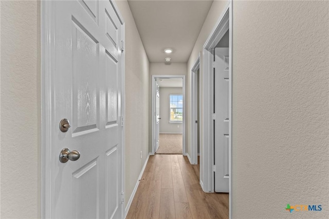 702 Stonevalley Rd, Temple, TX 76502 - hallway featuring hardwood / wood-style floors and a textured wall