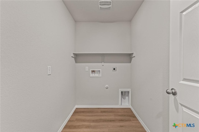 702 Stonevalley Rd, Temple, TX 76502 - washroom with hookup for a gas dryer, electric dryer hookup, hookup for a washing machine, and wood finished floors
