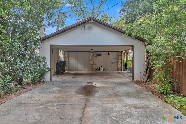 garage featuring a carport