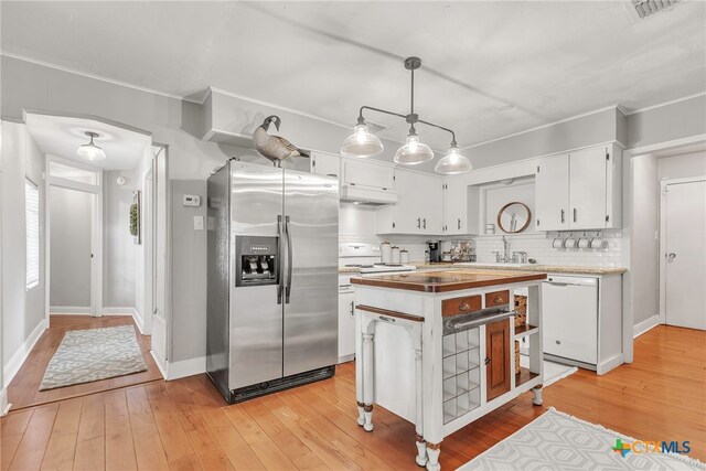 kitchen with stainless steel refrigerator with ice dispenser, light wood-type flooring, white cabinets, pendant lighting, and dishwasher