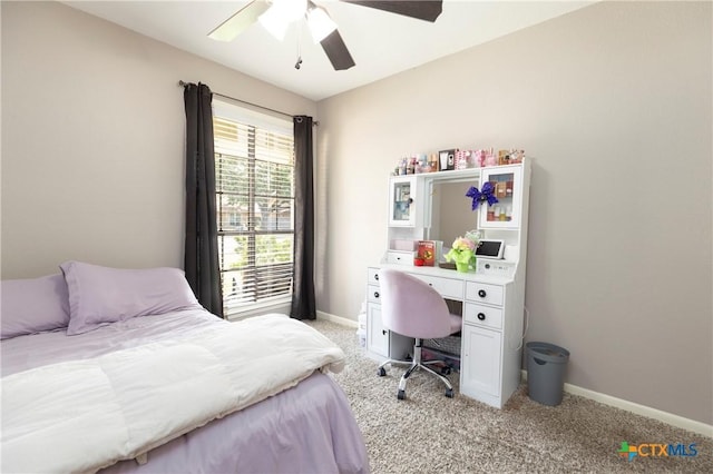418 Taos Dr, Victoria, TX 77904 - bedroom with light carpet, baseboards, and a ceiling fan