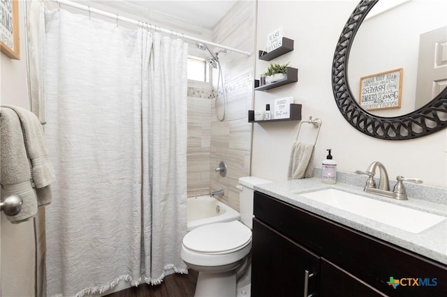 418 Taos Dr, Victoria, TX 77904 - bathroom with vanity, shower / tub combo, toilet, and wood finished floors
