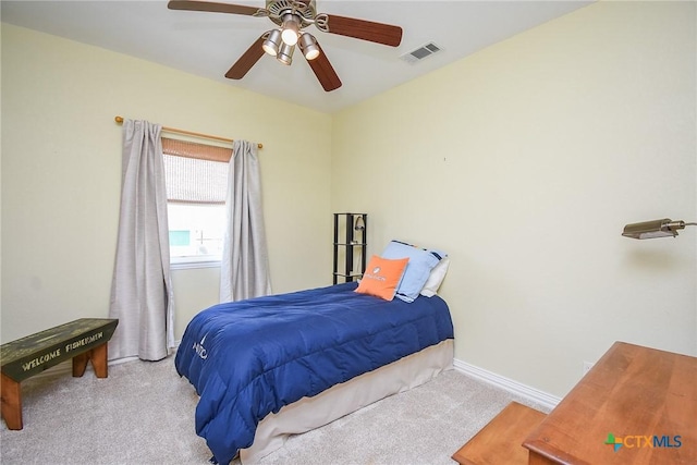 1588 W Bayshore Dr, Palacios, TX 77465 - carpeted bedroom with baseboards and ceiling fan