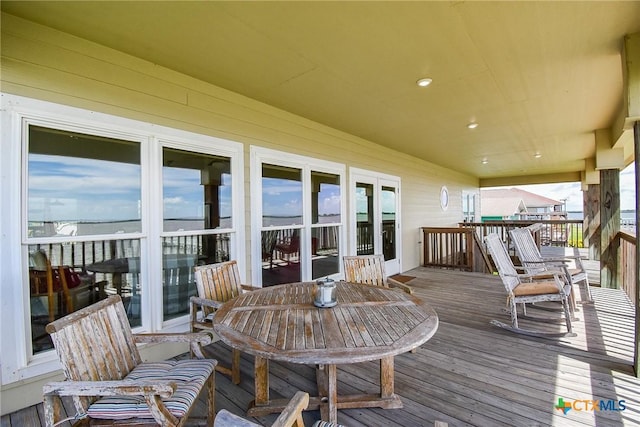 1588 W Bayshore Dr, Palacios, TX 77465 - wooden deck with outdoor dining space