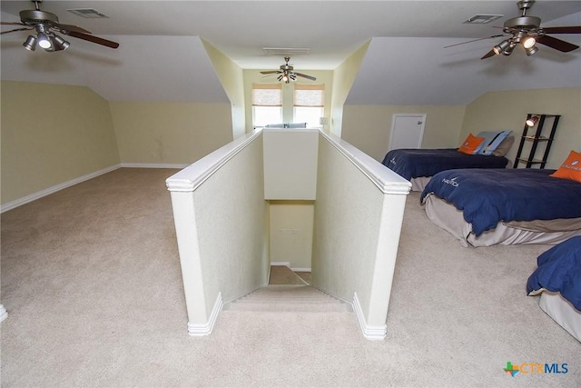 1588 W Bayshore Dr, Palacios, TX 77465 - stairway featuring carpet, a ceiling fan, baseboards, and vaulted ceiling