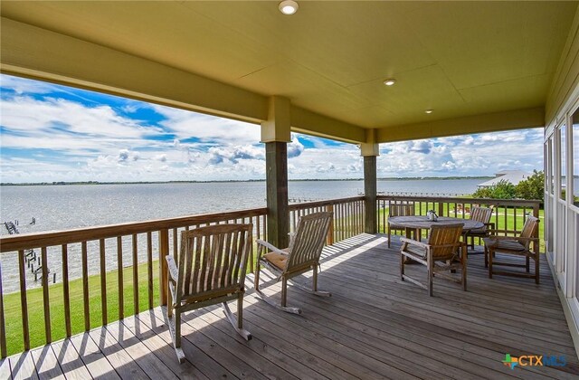 1588 W Bayshore Dr, Palacios, TX 77465 - wooden deck with a water view