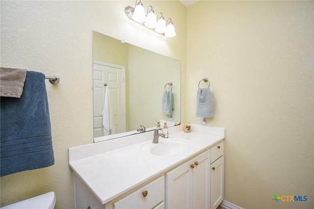 1588 W Bayshore Dr, Palacios, TX 77465 - bathroom featuring vanity and toilet