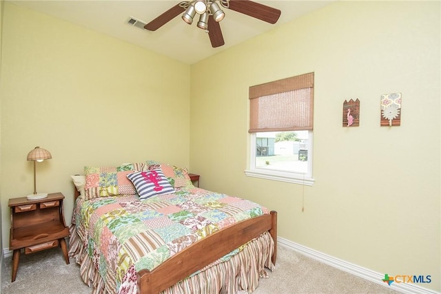 1588 W Bayshore Dr, Palacios, TX 77465 - bedroom featuring carpet flooring, baseboards, and a ceiling fan