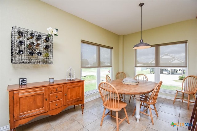 1588 W Bayshore Dr, Palacios, TX 77465 - dining space with light tile patterned floors and baseboards
