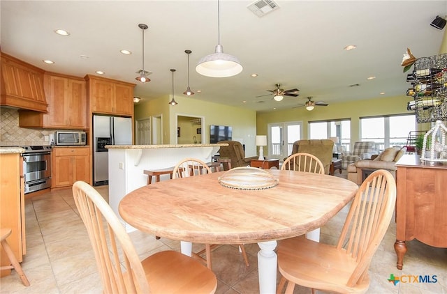 1588 W Bayshore Dr, Palacios, TX 77465 - dining area featuring a ceiling fan, recessed lighting, and light tile patterned floors