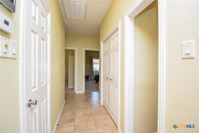 1588 W Bayshore Dr, Palacios, TX 77465 - hallway with light tile patterned flooring and baseboards