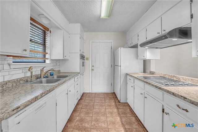 1123 Rhonda Lee St, Copperas Cove, TX 76522 - kitchen with under cabinet range hood, a sink, white appliances, white cabinetry, and a textured ceiling