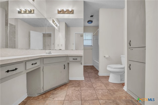 full bathroom featuring vanity, a textured ceiling, toilet, and  shower combination