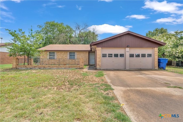 1123 Rhonda Lee St, Copperas Cove, TX 76522 - single story home with driveway, an attached garage, brick siding, and a front yard