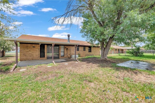 1123 Rhonda Lee St, Copperas Cove, TX 76522 - rear view of house with a patio, brick siding, and central air condition unit